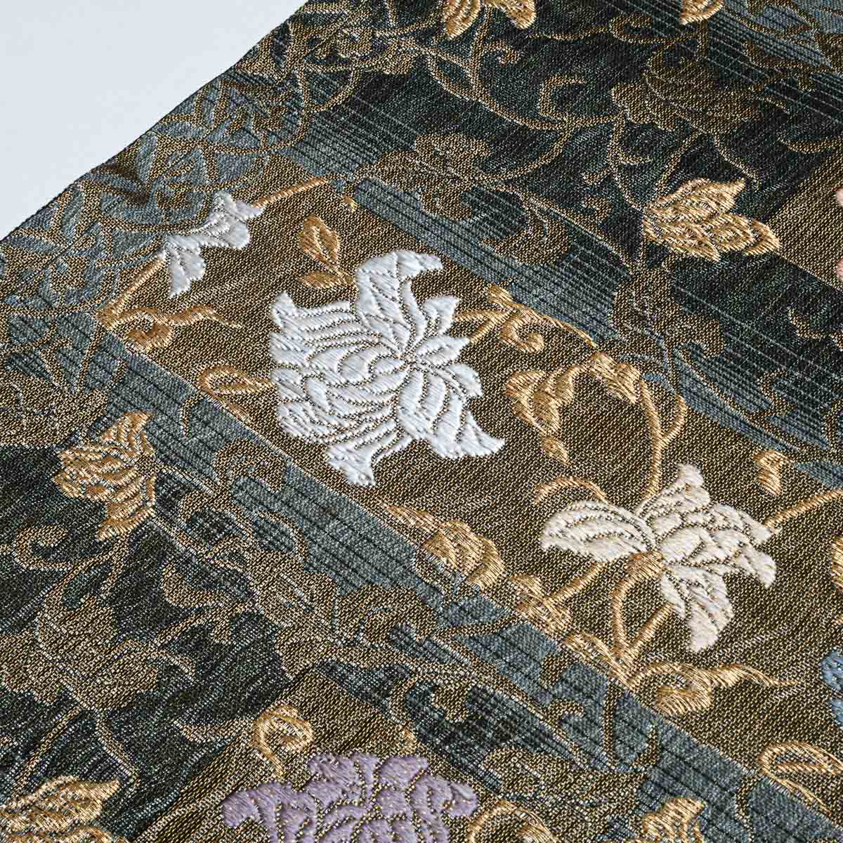 美品】名古屋帯 唐織 花唐草文 横段 ダークブルー 黒 金糸入り 西陣織